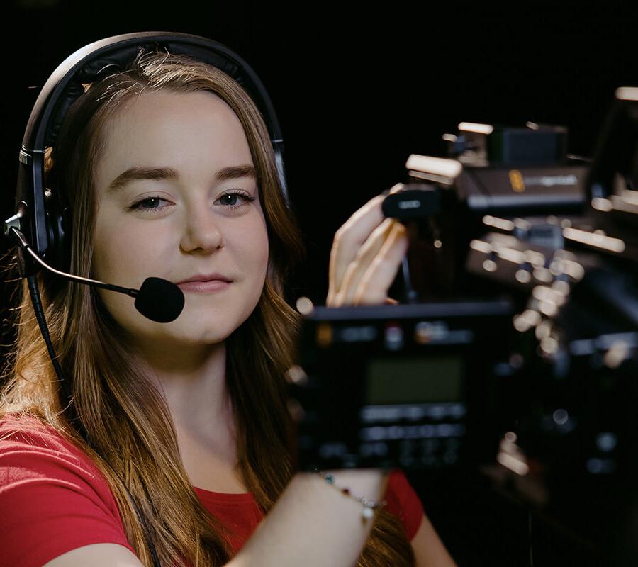 a cinema arts student holding a video camera