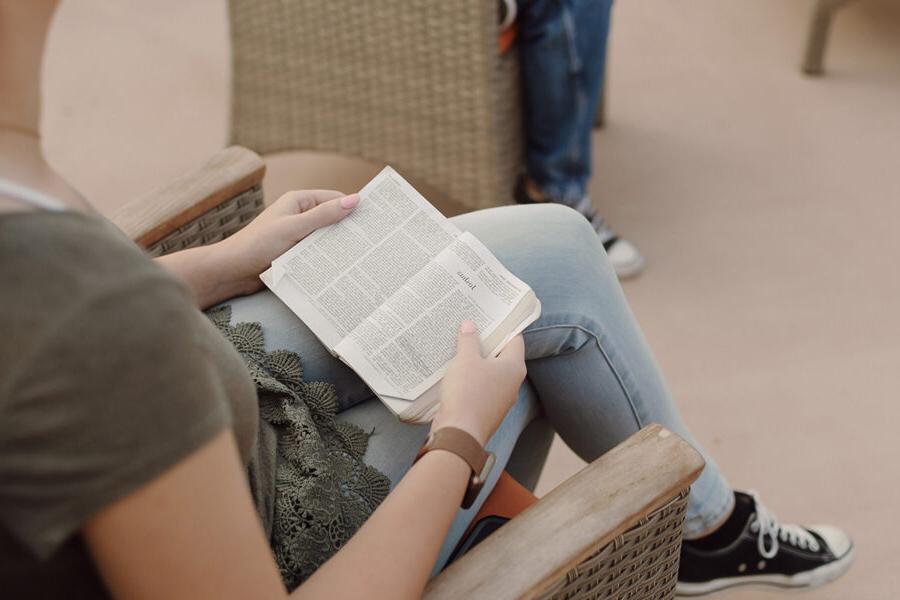 A biblical studies major reading a Bible