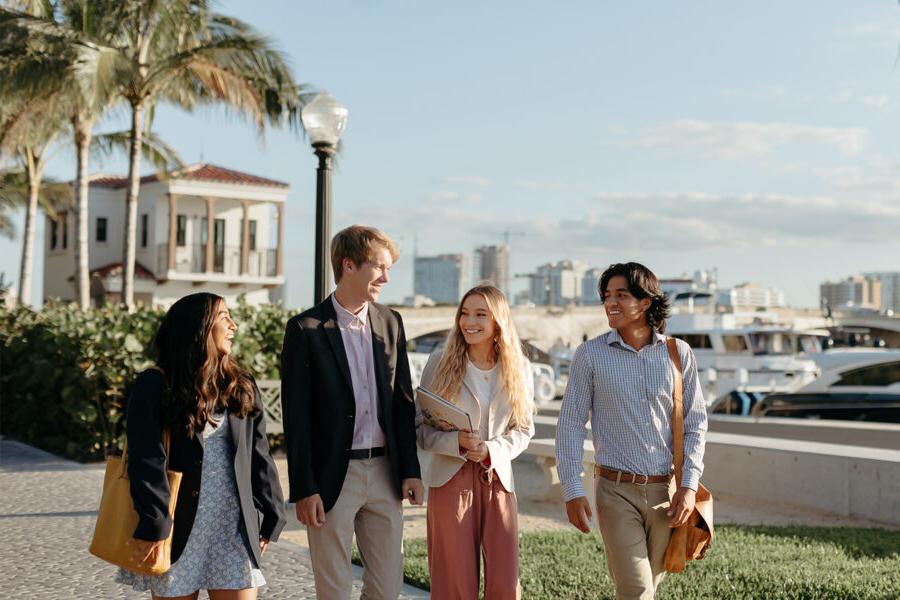master of business administration mba students walk near the intercoastal waterway in West Palm Beach.
